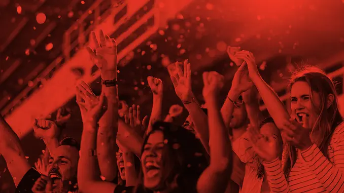 Fans cheering with red hue